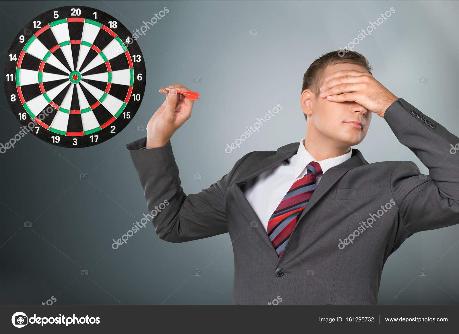 depositphotos_161295732-stock-photo-young-businessman-playing-darts.jpg