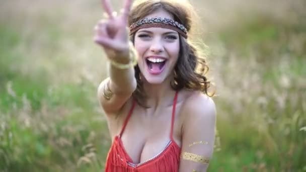 depositphotos_80122972-stock-video-hippie-girl-showing-a-peace.jpg