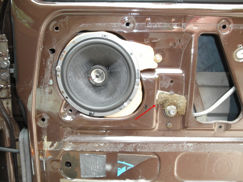 speaker in door showing plywood mounting plate.jpg
